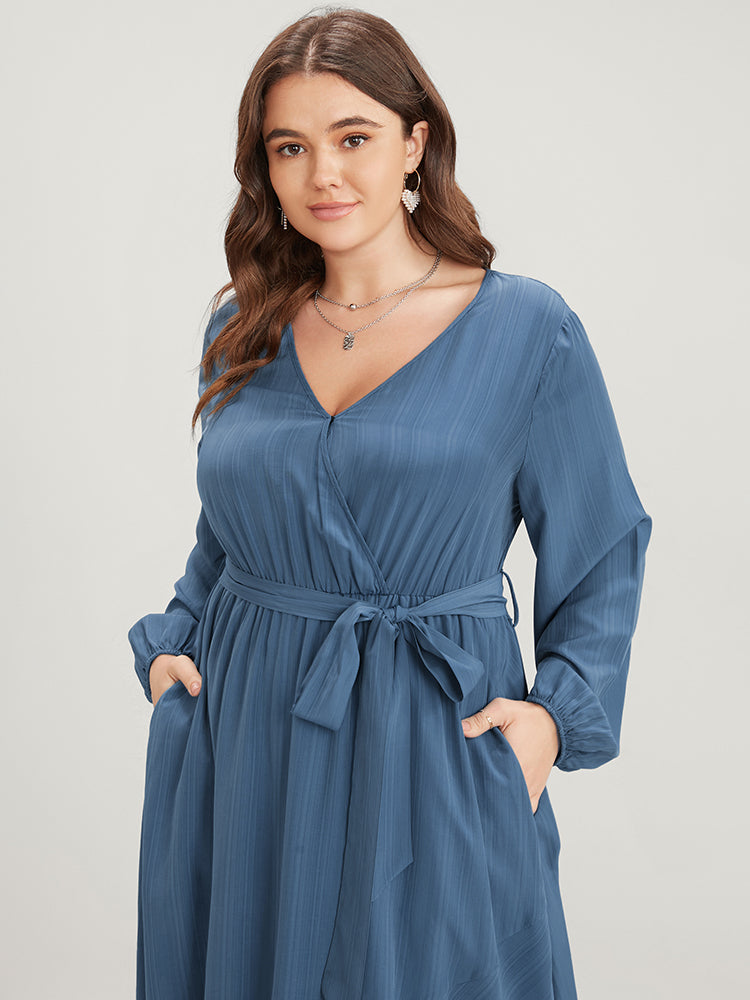 Solid Surplice Neck Lantern Sleeve Pocket Belted Asymmetrical Hem Dress